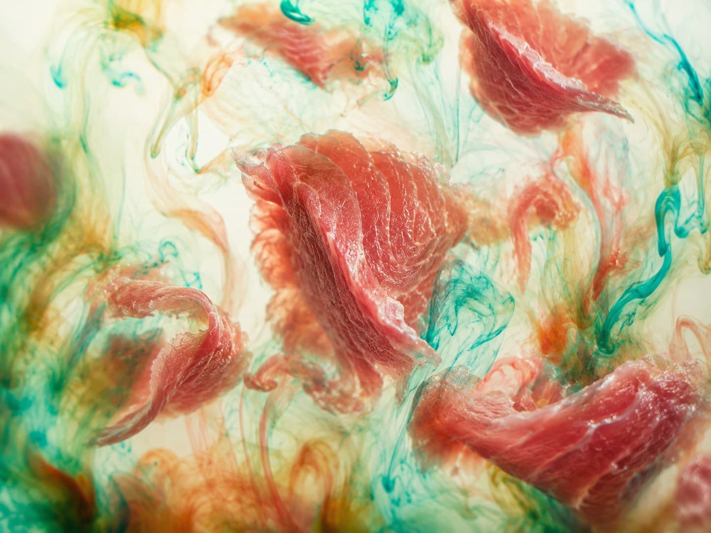 Tuna slices amid swirling ink